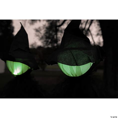 Illuminate your Halloween night with a Glowing Face Witch Decor Set